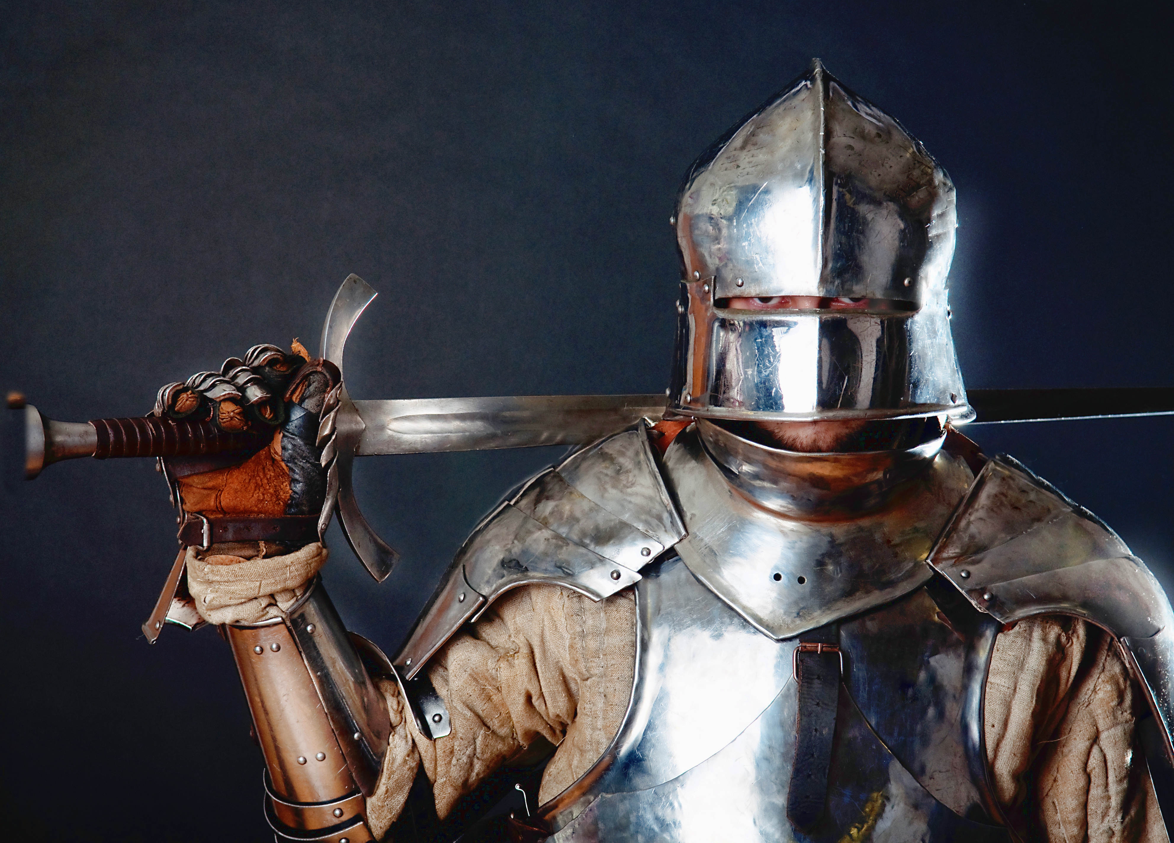 Medieval Knight Helmet And Sword Wallpaper