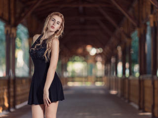 Blonde Girl In Black Dress wallpaper