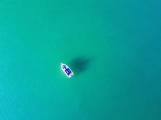 Boat In Blue Sea Water wallpaper