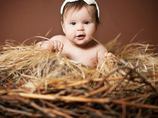 Cute Baby Child Is Sitting On Haystack wallpaper