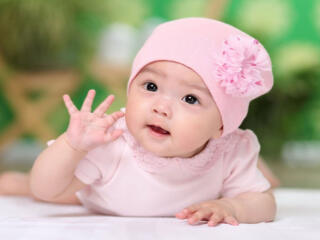 Cute Baby Girl Child in Light Pink Dress wallpaper