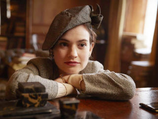 Lily James In The Guernsey Literary and Potato Peel Pie Society wallpaper