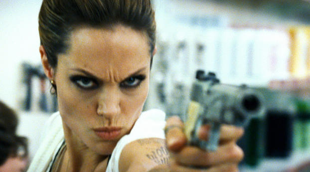Angelina Jolie with gun   Wallpaper 600x800 Resolution