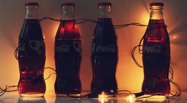 coca-cola, bottles, garlands Wallpaper 2300x1000 Resolution