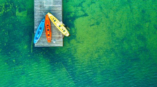 Colorful Kayak Boats Wallpaper 1440x2560 Resolution
