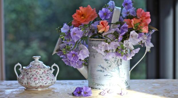 flowers, watering can, table Wallpaper 2560x1024 Resolution