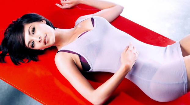 Kristin Kreuk Sleeping Pose Wallpaper 1366x768 Resolution