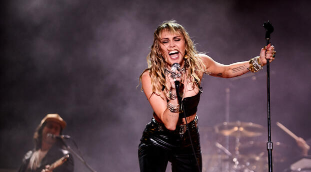 Miley Cyrus Rockstar Wallpaper 1234x576 Resolution