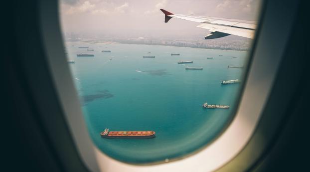 porthole, airplane, top view Wallpaper 1336x768 Resolution